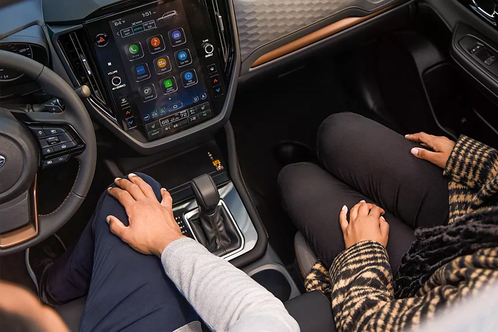 View of two passengers in a 2025 Subaru SUV looking down through the panoramic moonroof