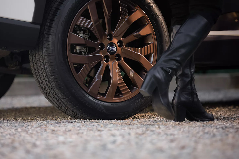 Close-up of tire and bronze-finish wheel on a 2025 Subaru SUV