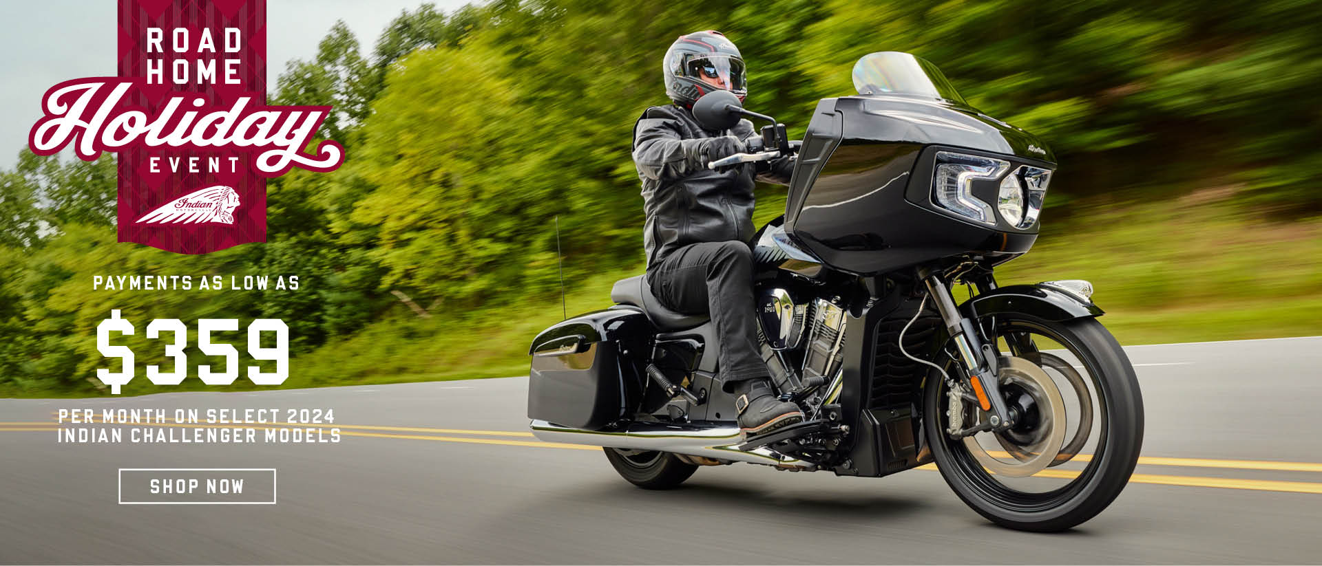 Indian Challenger riding down a road in a forest landscape. Promotional offer: Payments as low as $359 per month on Select 2024 Challenger models.